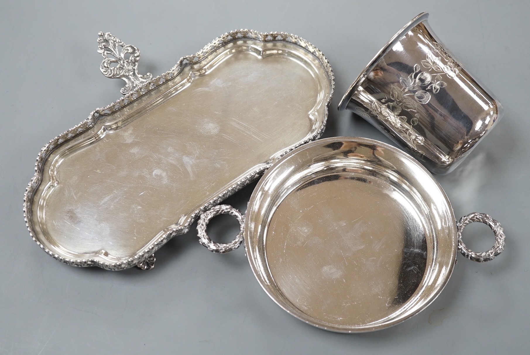 An engraved French white metal beaker, 81mm, a similar two handled shallow bowl by Risler and a modern Italian white metal snuffers stand, gross 13.5oz.